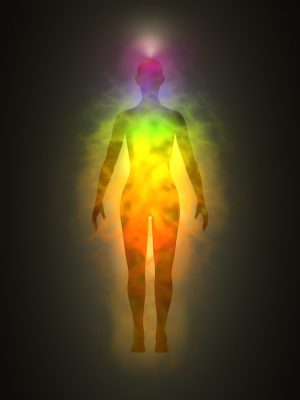Illustration of human (woman) energy body silhouette with aura and chakras. Theme of Creation, healing energy, connection between the body and soul.